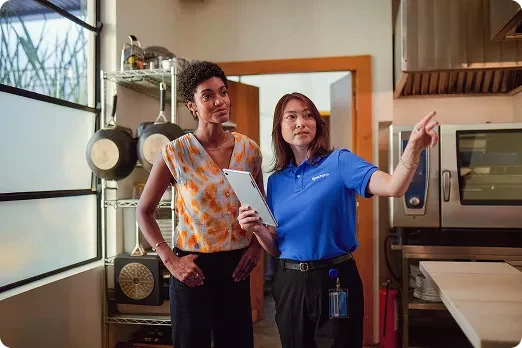 Spectrum technician discussing connectivity with a small business customer